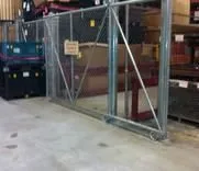 Chain link sliding gate inside a warehouse storage area